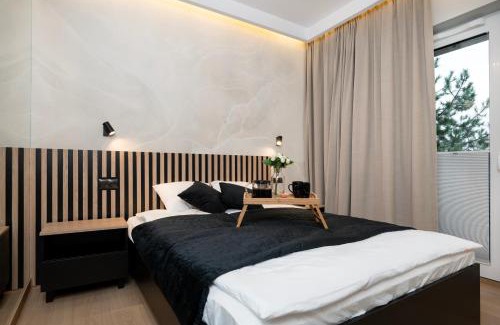 Lodz Apartment | Experience Comfort at Łódź Prestige Suites with Office Space