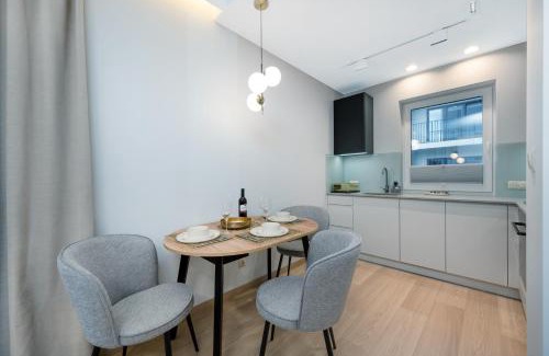 Lodz Apartment | Experience Comfort at Łódź Prestige Suites with Office Space