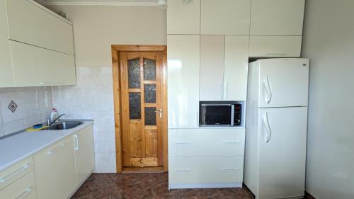 Berehove Apartment | Family-Friendly Two-Bedroom Apartment by the Pool