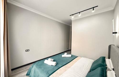 Almaty Apartment | Discover ЖК AMIR: Family-Friendly Stay Near Mega Flat
