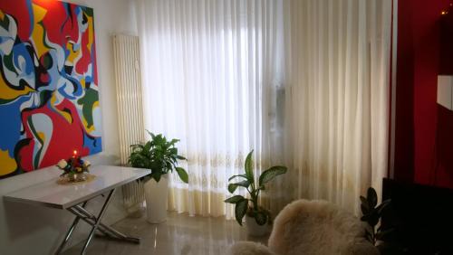 Isola del Bosco - Delle Corti Apartment | Elegant Milan Apartment with Restaurant & Family Amenities