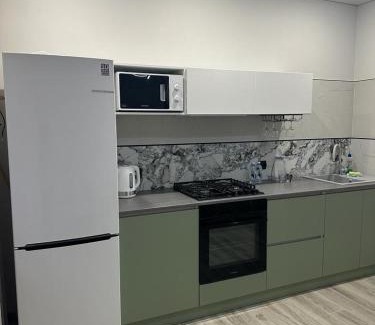 Kostanay Apartment | Modern City Center Apartment - Family Friendly & 10/10 Rated