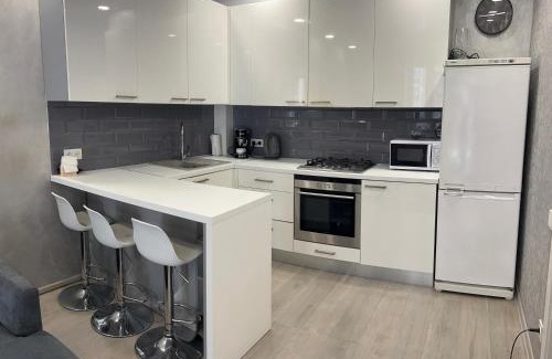 Irpin Apartment | Modern Apartment with Versal Park View - Highly Rated!