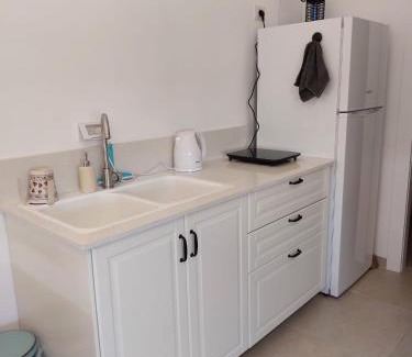 Talmei Yosef Apartment | Experience נצר - Rustic Village Lodging with Ocean Views