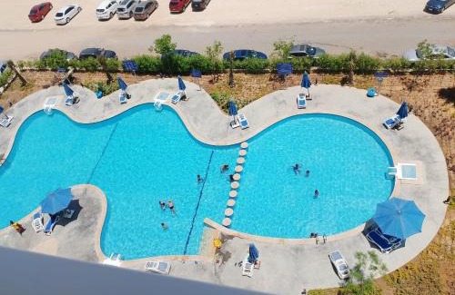 Ad-Dab'ah Apartment | Discover العلمين: Family-Friendly Escape with Pool Access