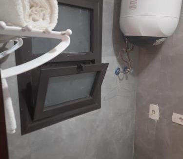 Al-Manasrah Apartment | Discover Porto Said Hotel with Pool & Family-Friendly Vibe