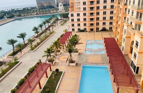 Bay La Sun Apartment | Baylasun View: Oceanfront Retreat with Pool & Family-Friendly