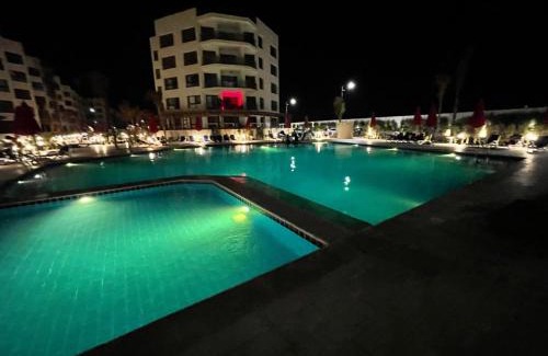 Al-Manasrah Apartment | Discover Porto Said Resort: Oceanfront Comfort & Pool Access