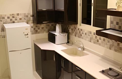 Al Hamra Hotel | Comfortable Awana Suites: Ideal for Families and Accessibility