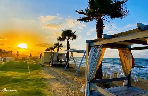 Al-Manasrah Apartment | Tranquil Room and Hall at Porto Said Resort with Ocean Views