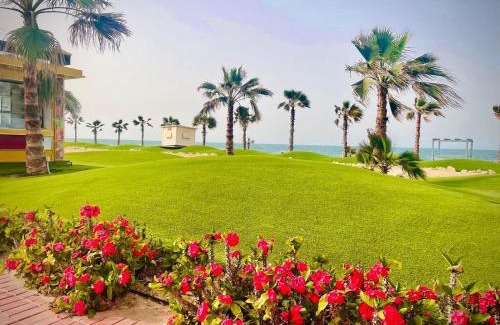 Al-Manasrah Apartment | Tranquil Room and Hall at Porto Said Resort with Ocean Views
