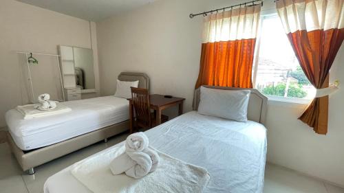 Huai Kapi Hotel | Discover K2 Guesthouse: Family-Friendly with Breakfast Included