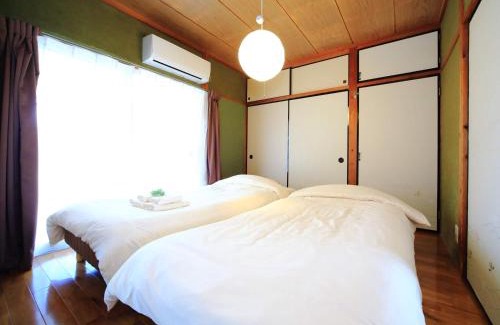 Izumi House | Discover カモンイン 寿: Family-Friendly Retreat with 10/10 Rating