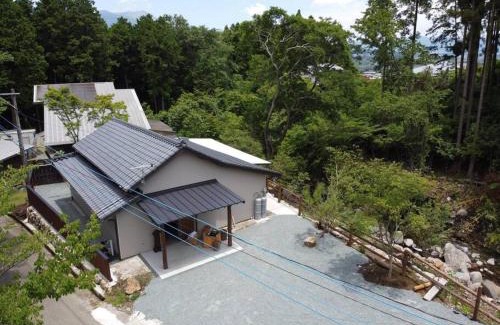 Minamiaso House | Relaxing Retreat at コテージくぎの with Open-Air Hot Springs