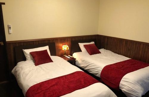 Oshima House | Discover 露伴ロハンrohan: Cozy Retreat with Hot Tub & Kitchen