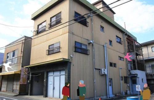 Tsurugi-cho House | Family-Friendly Comfort at 上田屋 半田館 with Kitchen Amenities