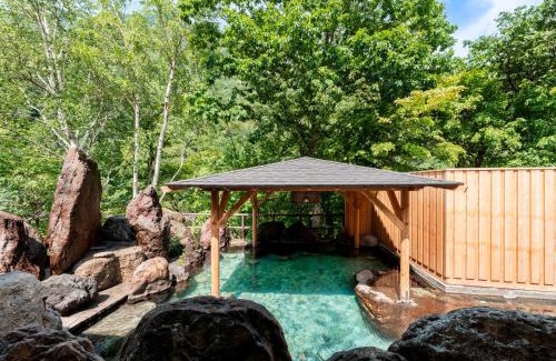 Kamikawa Hotel | Discover 層雲閣: Family-Friendly Retreat with Hot Tub