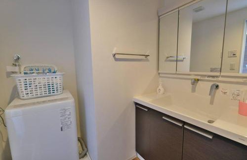 Marunouchi Apartment | Relax in Our Cozy Suite with Wheelchair Access & Child Care