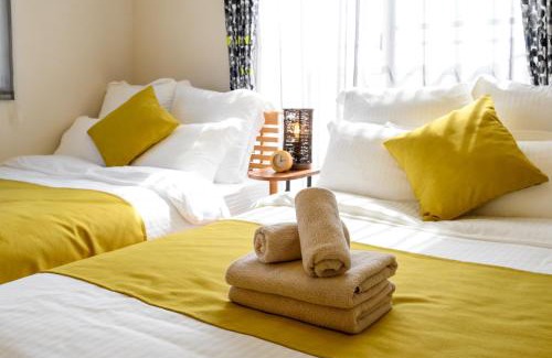 Inamine House | Ideal Getaway for 12: Enjoy Comfort Near South Wind House