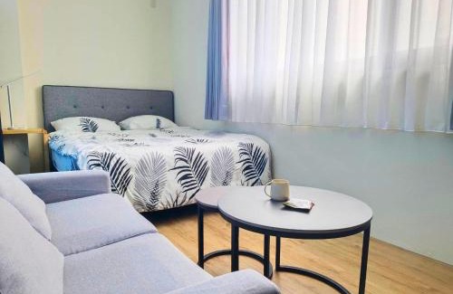 East District Apartment | Guest Rated 9.7: Good Garden Apartment with Kitchen Access