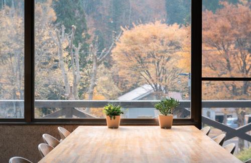 Yuzawa Cabin | Convenient Getaway at 豊島ロッヂ with Hot Tub & Dining