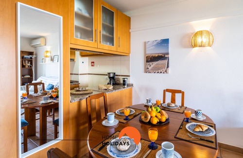 Areias de Sao Joao Apartment | Explore Center City: AC, Shared Pool & Top-Rated Stay