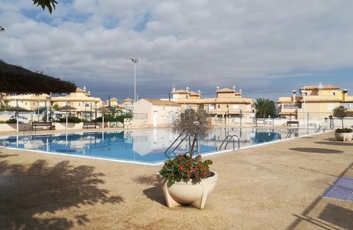 Monte Faro Apartment | Comfort at Brisamar 002: Poolside Retreat for Families