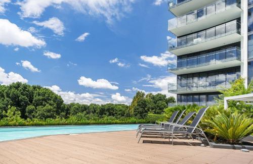 City East Apartment | Inviting 1-Bed Retreat with Pool, Gym & Scenic Views