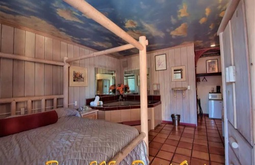 Yucca Valley Hotel | Relaxing King Bed Suite with Jetted Tub & Pool Access