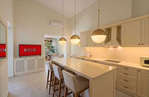 Rethymno Villa | Beachside Retreat with Kids Pool, Spa & Private Sun Beds
