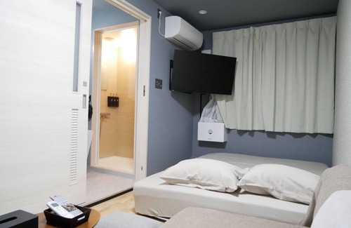 Amami Hotel | Exceptional HOOD Inn: Private Sauna & Family-Friendly Stay