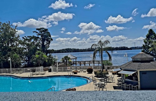 Florida Central Atlantic Coast Condo | Family-Friendly Lakefront Retreat with Pool & Hot Tub