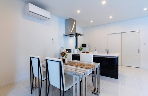 Nakijin House | Seaside Jacuzzi Villa: Steps from Kouri Beach in Okinawa