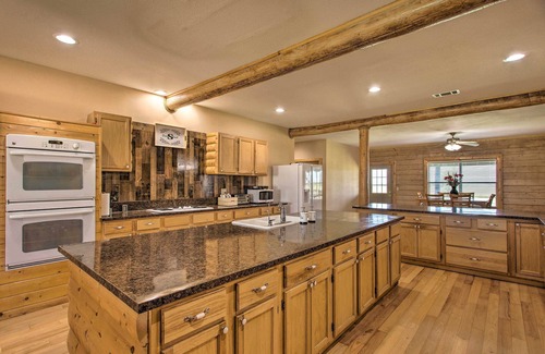 Rosston House | Inviting Log Cabin Retreat with Jungle Gym & Volleyball