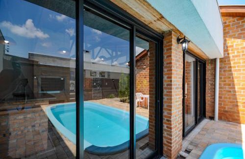 Foz do Iguacu House | Idyllic Retreat with Pool and Gourmet Area for 12 Guests