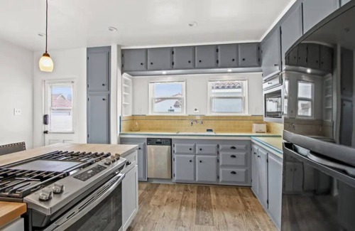 Tustin House | Elegant 1920's Spanish Revival Home with Ocean View & Spa