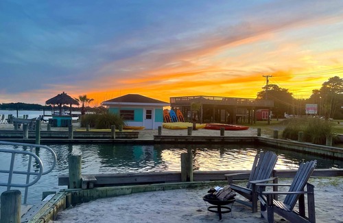 Chincoteague Cottage | Cozy Snug Harbor Waterfront Cottage with Lighthouse Views