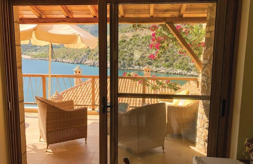 Arkadiko Chorio Apartment | Cozy 2-Bedroom Retreat with Oceanfront Views in Varia Kinouria