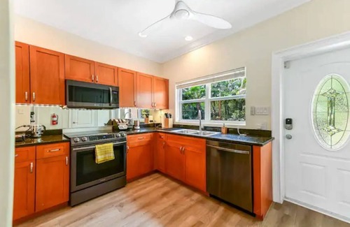 West Bay House | Cozy Condo with Pool and Ocean View, Steps from the Beach