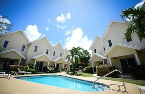 West Bay House | Cozy Condo with Pool and Ocean View, Steps from the Beach