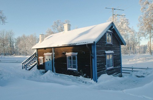 Mullsjo House | Idyllic Wooden Retreat on a Farm Near Jönköping