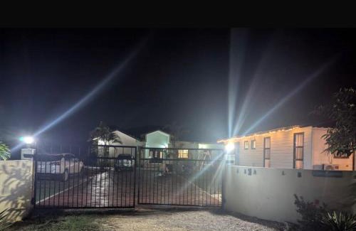 Ladyville House | 2 bedroom Guest House with comp ride to the airport