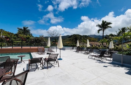 Sao Sebastiao Apartment | Stylish 2-Bedroom Suite Steps from Praia da Baleia