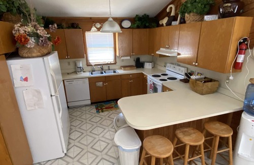 Carova Beach House | Pet-Friendly Waterfront Getaway with Hot Tub & Boat Dock