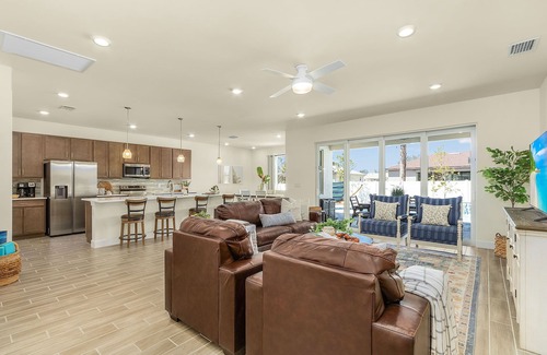 Trafalgar House | Inviting Home with Outdoor Kitchen & Waterfall Pool Experience
