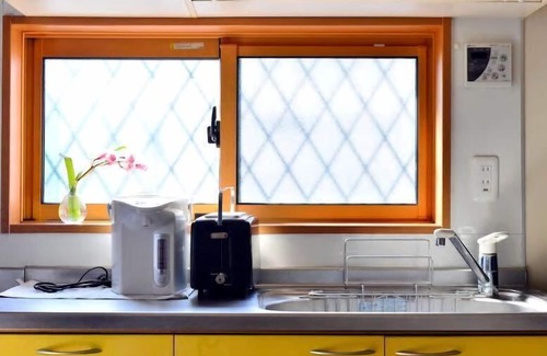 Ota House | Quiet Retreat: Steps from Asakusa Line with Family Amenities