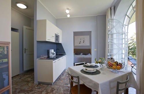 Carciano Apartment | 2-room apartment with terrace and garden in an Art Nouveau villa with communal pool