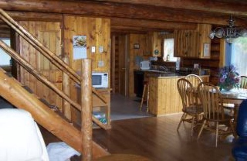 Condon House | Enchanting Log Home with Spa and River Views