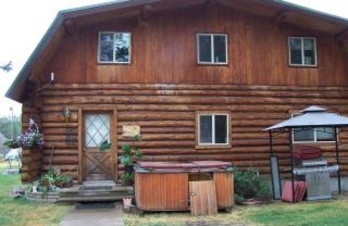 Condon House | Enchanting Log Home with Spa and River Views