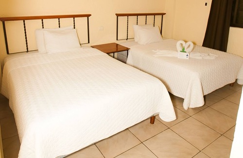 Downtown Cancun Hotel | 2 Units | Family Stay in Cancún | Pool & Gardens Near Puerto Juárez Beach